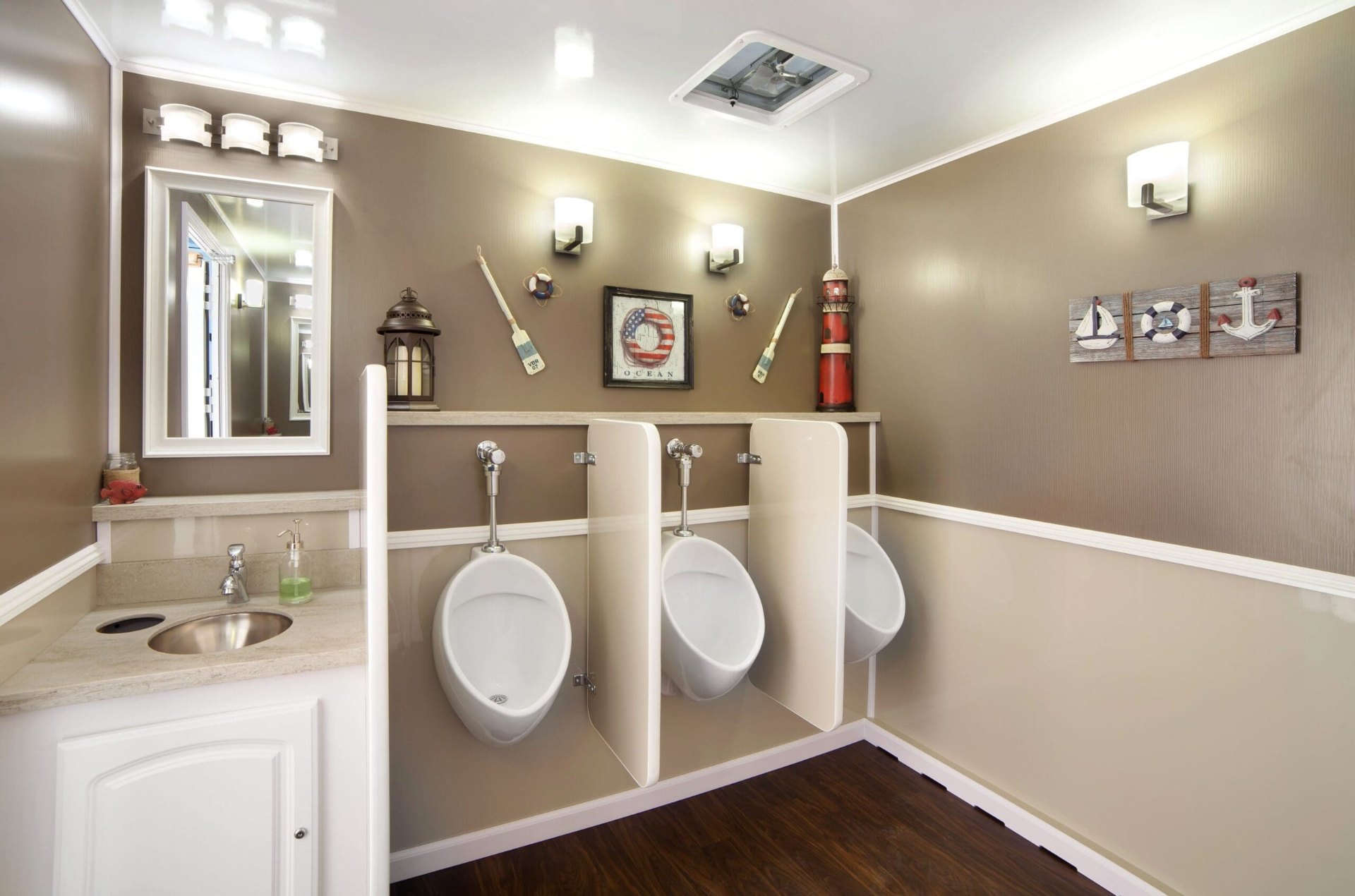 Luxury restroom trailer interior with marble vanity and gold fixtures